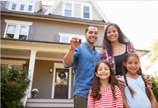 A picture of a family outside their ready-to-sell house in New Jersey.